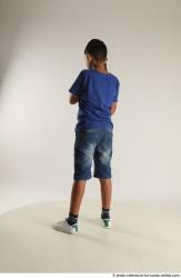 TIMBO STANDING POSE WITH GUN